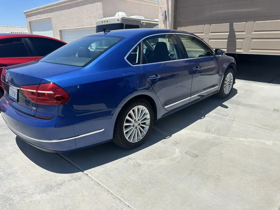 VW Passat window tint: Remove all old tint from sides and rear, 5% rear 3 windows, 15% front doors, 5% windshield strip (view 2)