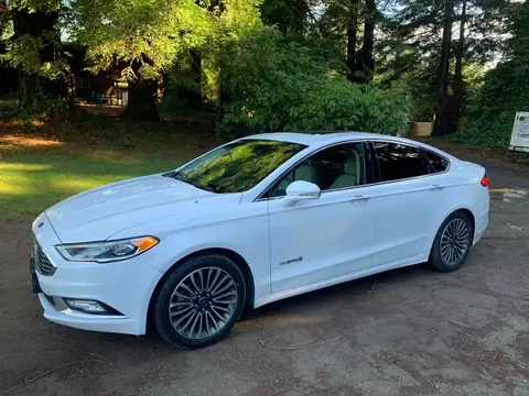 White sedan window tint: 5% on back doors and rear windshield and visor (view 4)