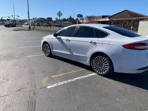 White sedan window tint: 15% on the front roll ups