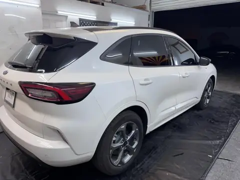 White SUV window tint: 5% Ceramic IR sides and rear, 35% Ceramic IR full windshield